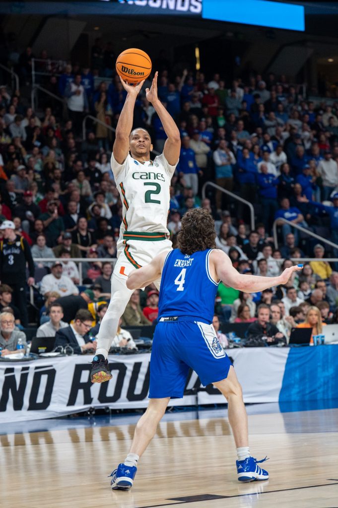 Fourth-year junior gaurd Isaiah Wong jumps up for a three-pointer during the first round of the NCAA tournament on Friday, March 17 at the MVP Arena.