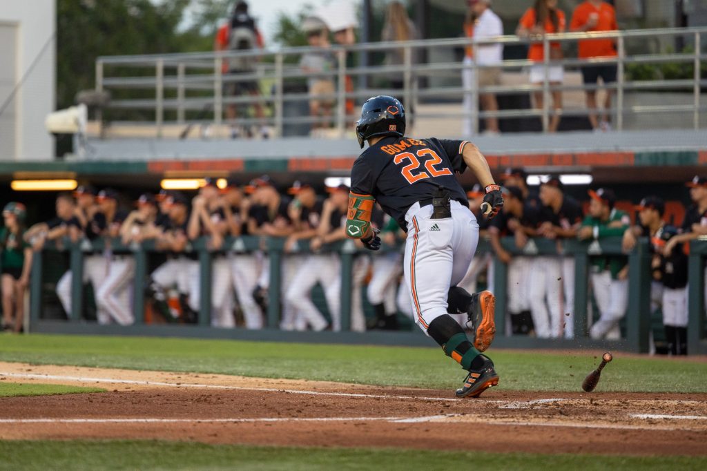 Senior outfielder Dario Gomez runs for first at the bottom of the second in Miami’s game against FSU on Friday, Mar. 31 at the Mark Light Field.