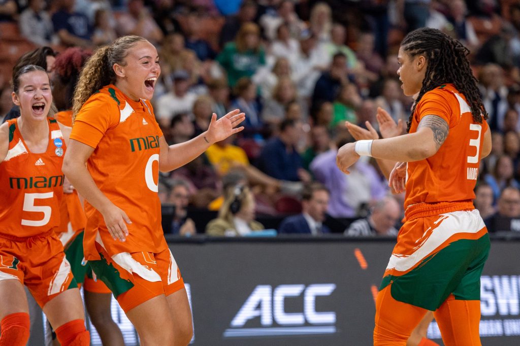 Kenza Salgues and Destiny Harden celebrate after taking a 20-point lead at the start of the third quarter of Miami's matchup against Villanova on Friday, Mar. 24 in the Bon Secours Wellness Arena in Greenville, S.C.
