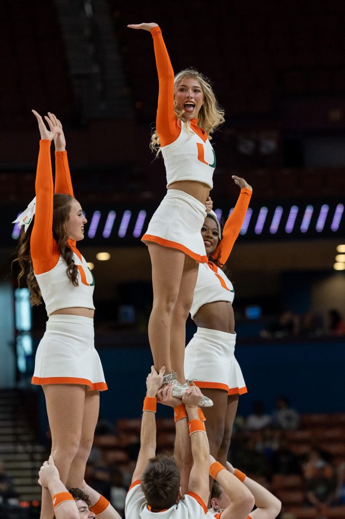 Miami’s cheer team completes a stunt during Miami’s first ever Elite Eight matchup against LSU in the Bon Secours Arena on Sunday, March 26.
