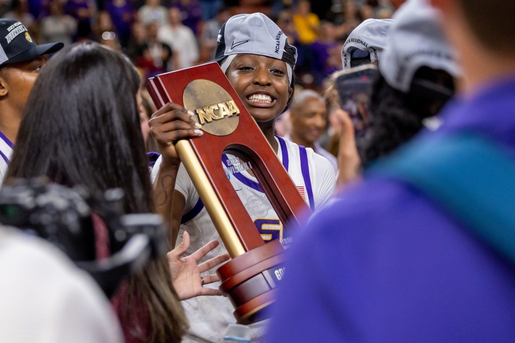LSU freshman Flau’jae Johnson poses with the NCAA Conference Award after the Lady Tigers defeated the ‘Canes in Miami’s first ever Elite Eight matchup in the Bon Secours Arena on Sunday, March 26.