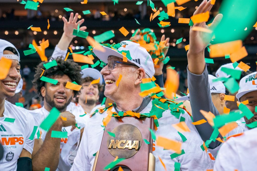 Head coach Jim Larrañaga holds the NCAA Midwest Regional Championship Trophy after Miami’s 88-81 win over the University of Texas in the T-Mobile Center in Kansas City, MO on March 26, 2023.
