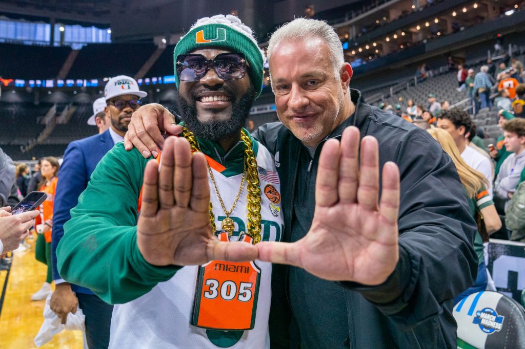 ‘Canes superfan “JD Da Boss’ and MSP Recovery CEO John Ruiz throw up the U after Miami’s 88-81 Elite Eight win over the University of Texas in the T-Mobile Center in Kansas City, MO on March 26, 2023.
