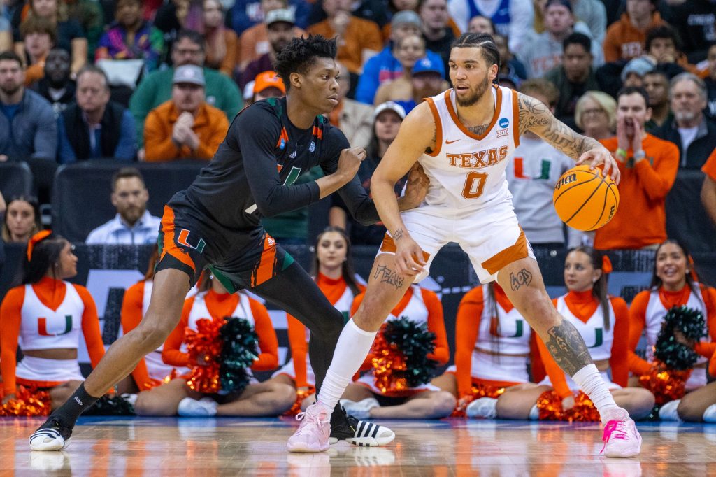 Fourth-year junior forward Anthony Walker guards senior forward Timmy Allen during the first half of Miami’s Elite Eight matchup against the University of Texas in the T-Mobile Center in Kansas City, MO on March 26, 2023.