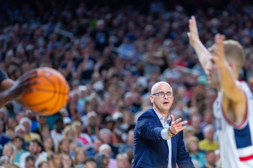 Huskies head coach Dan Hurley motions to his players as the ‘Canes inbound the ball during the first half of Miami’s Final Four matchup against the University of Connecticut in NRG Stadium in Houston on April 1, 2023.