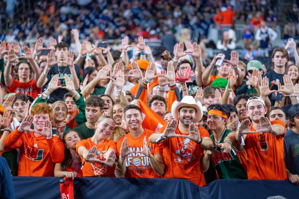 ‘Canes fans throw up the U before the start of the second half of Miami’s Final Four matchup against the University of Connecticut in NRG Stadium in Houston on April 1, 2023.