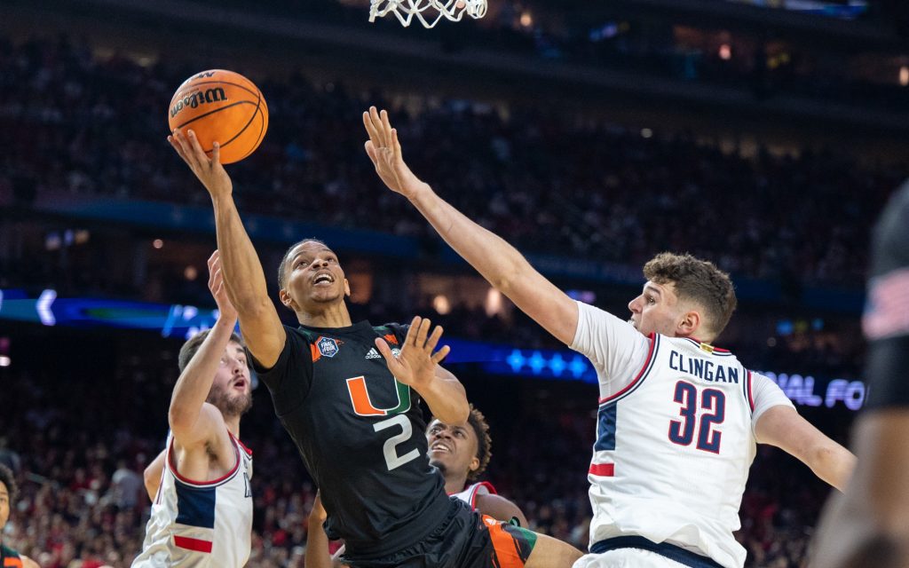 Fourth-year junior guard Isaiah Wong falls in attempt to complete a shot during the first half of Miami's Final Four loss on Saturday, April 1 at the NRG Stadium.