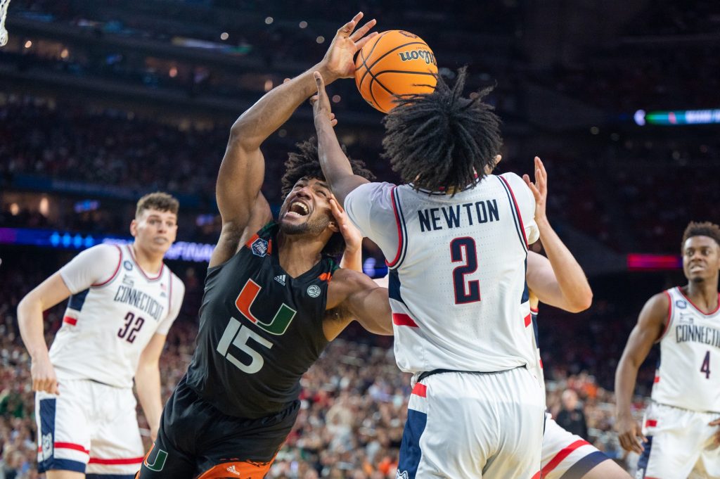 Third-year sophomore forward Norchad Omier tries to regain control of the ball during the first half of Miami's Final Four loss to the University of Connecticut on Saturday, April 1 at the NRG Stadium.